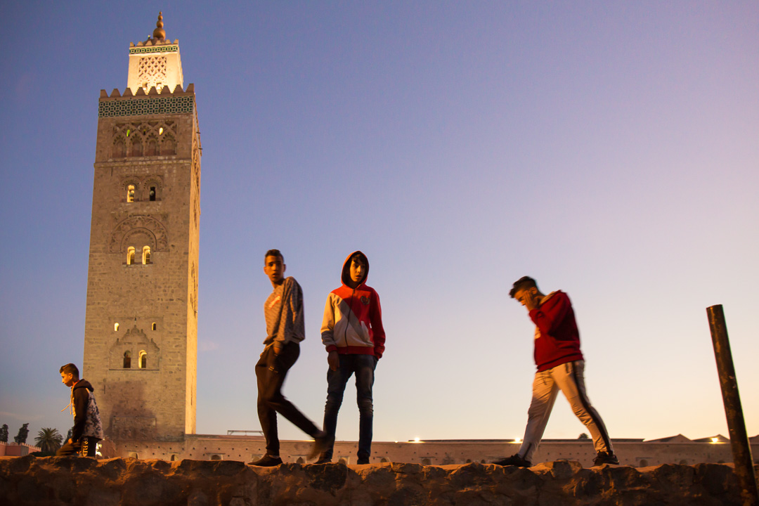 Young Moroccans walk in marrakesh