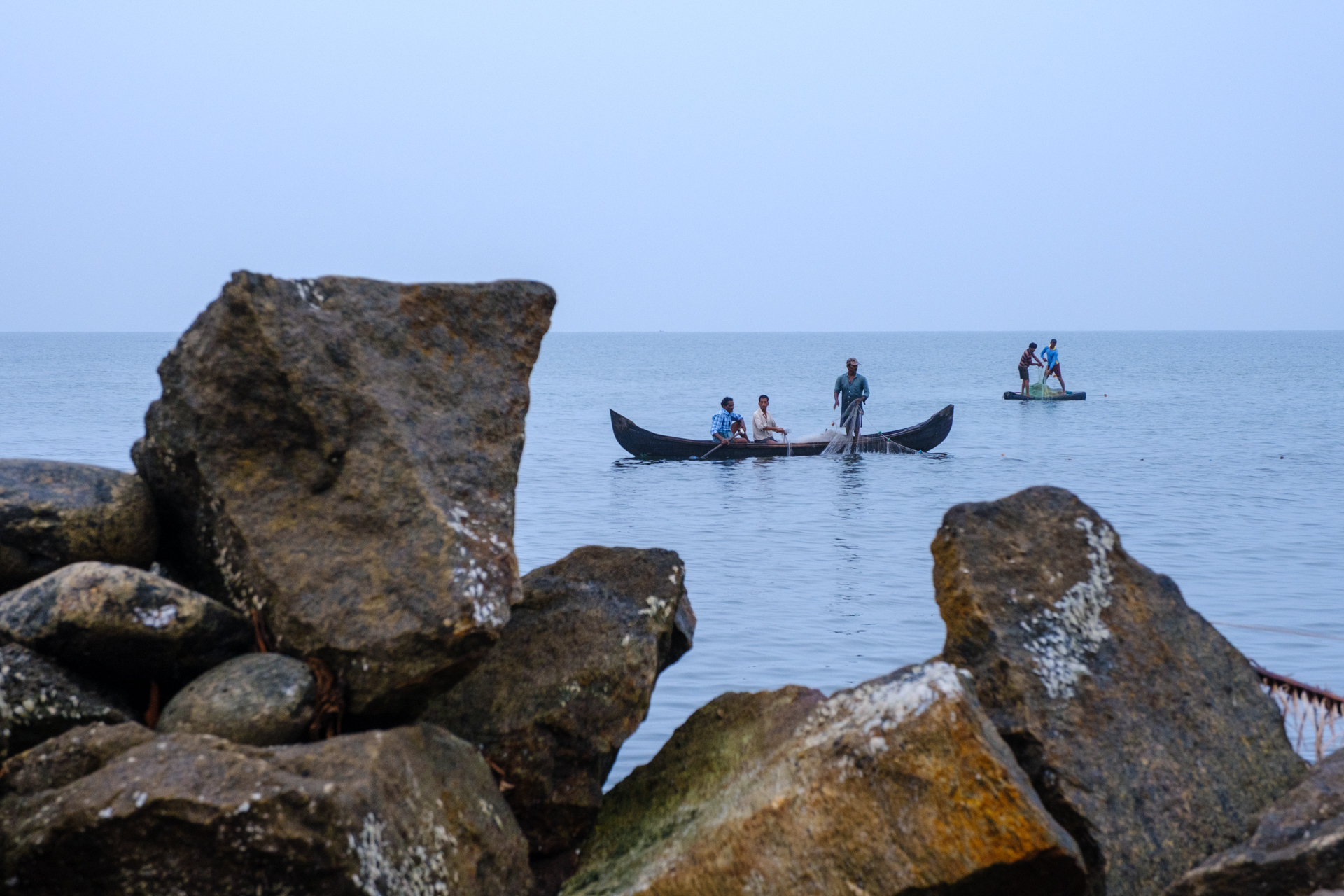 fishermen on the coast of fort kochi