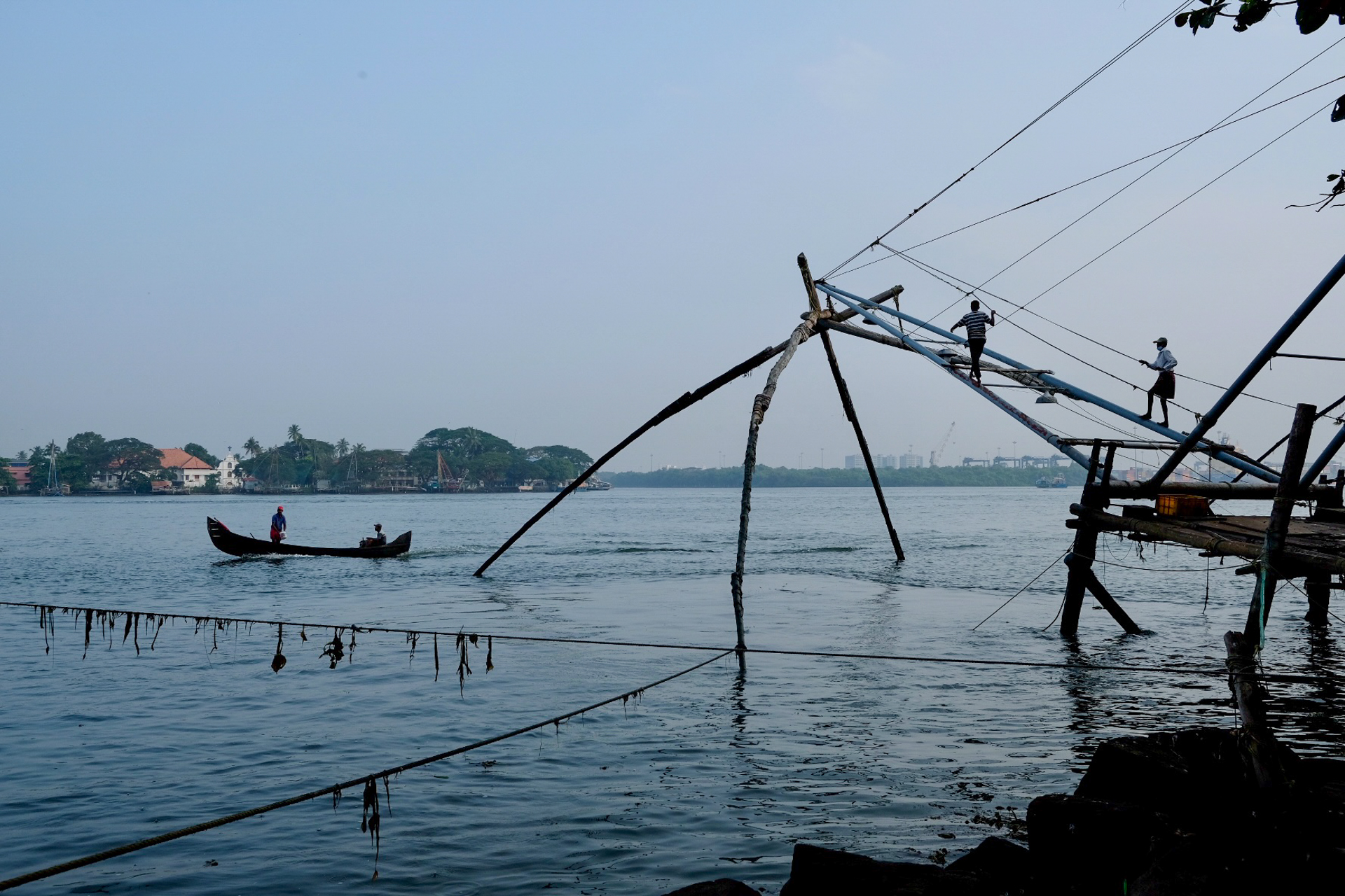 the fishing nets of fort kochi at work in the morning