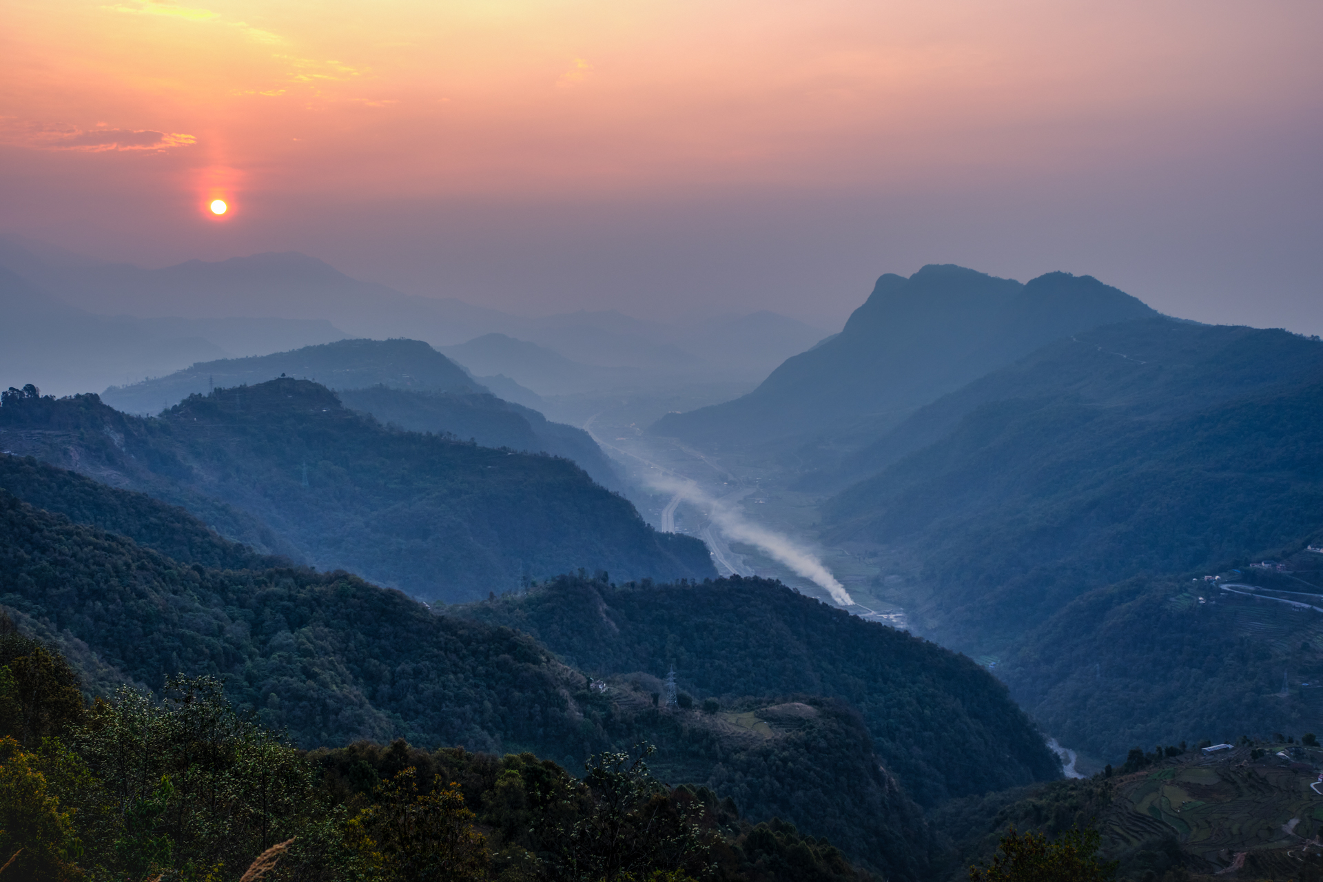 Himalayan valley at dusk seen from above Dhampus – scenic landscape from travel photography in Nepal